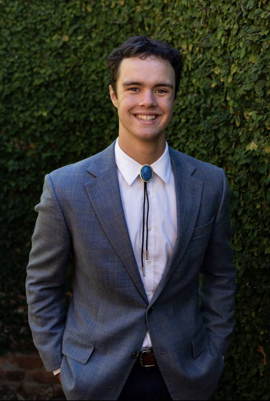 Peter Fast in a gray suit outdoors